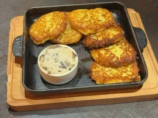 Potato pancakes with mushroom sauce