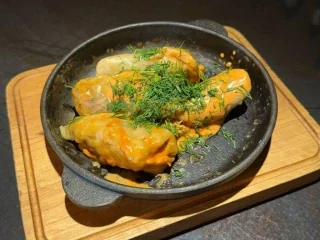 Cabbage rolls in cream and tomato sauce